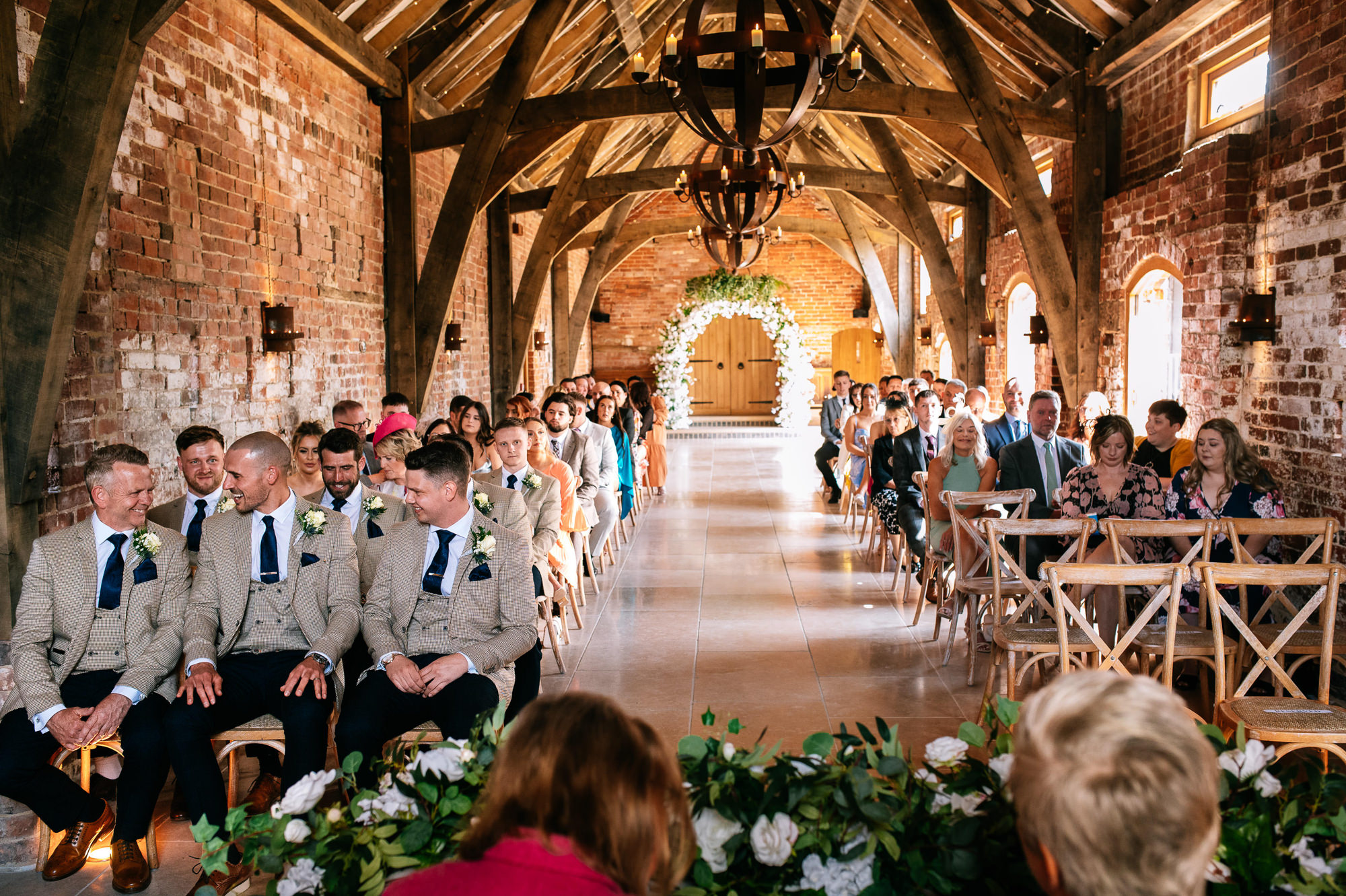 groom and groomsmen waiting for the bride to arrive in the oak room at grangefields