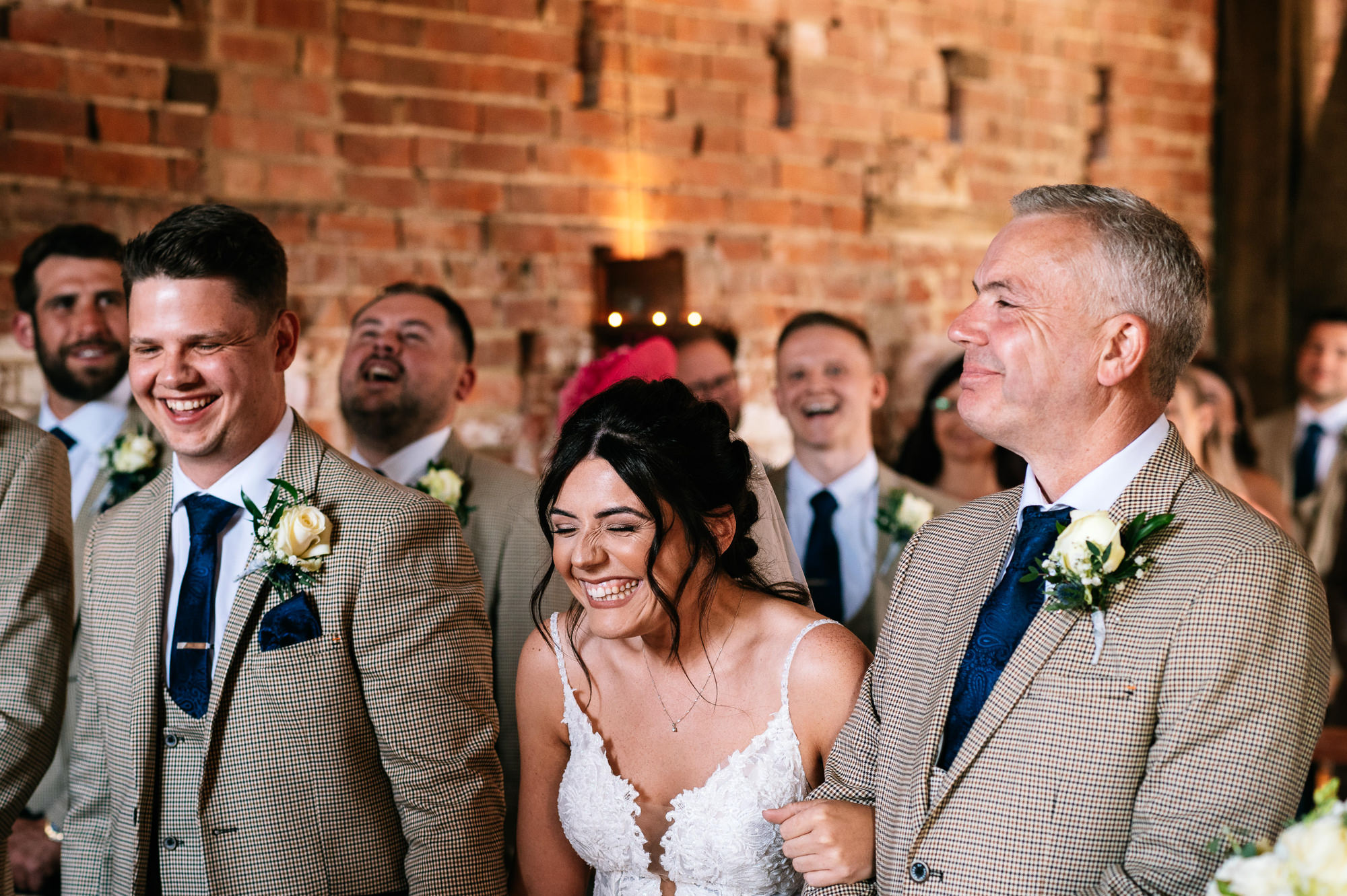 bride and groom laughing during the barn ceremony