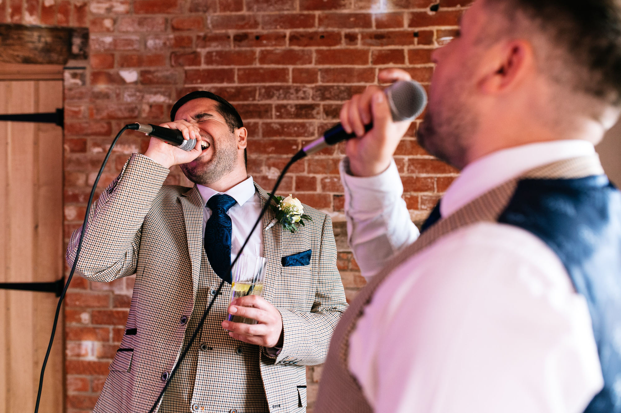 groomsmen enjoying a bit of karaoke