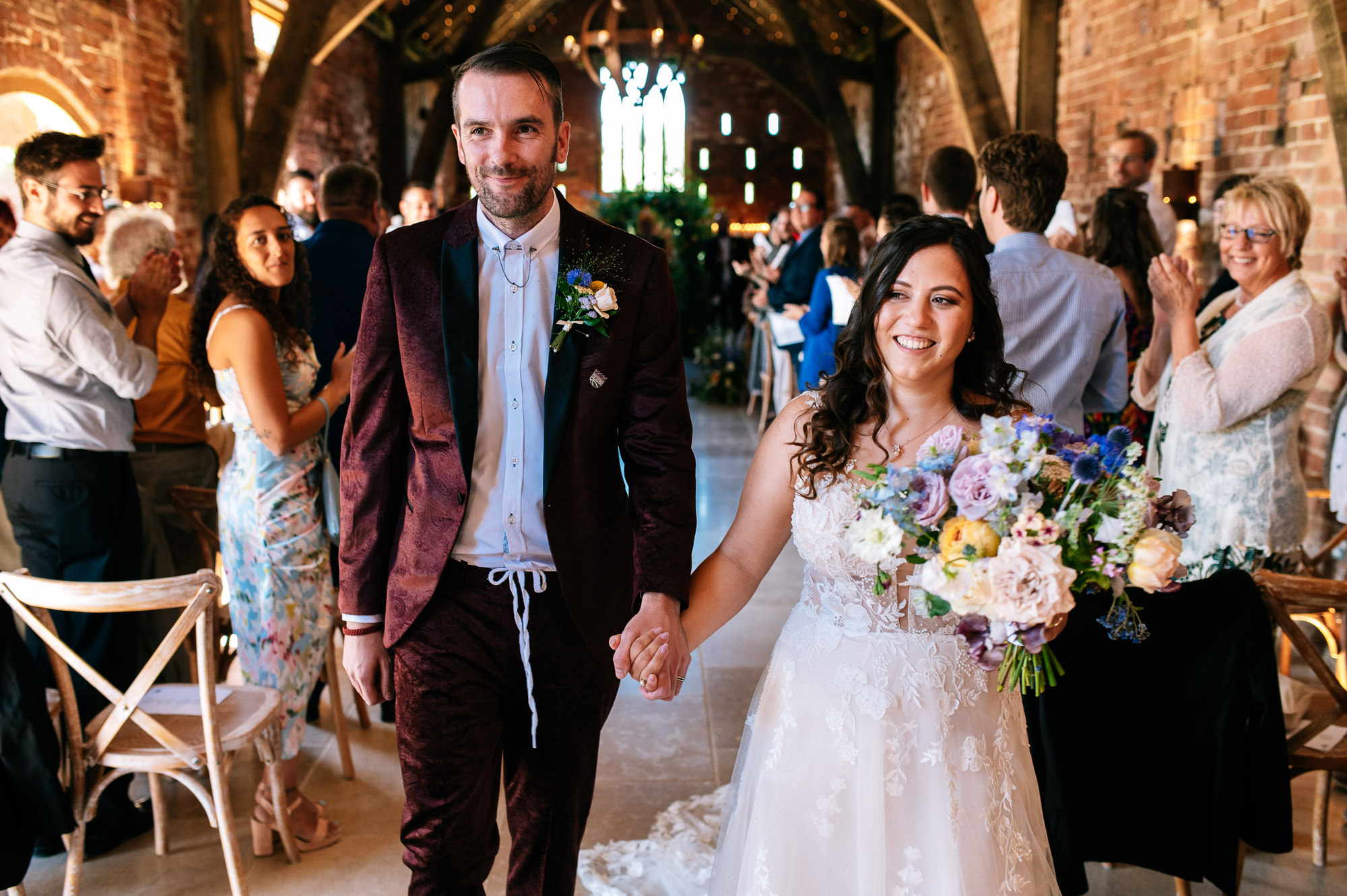 just married walking down the aisle at this derbyshire barn venue