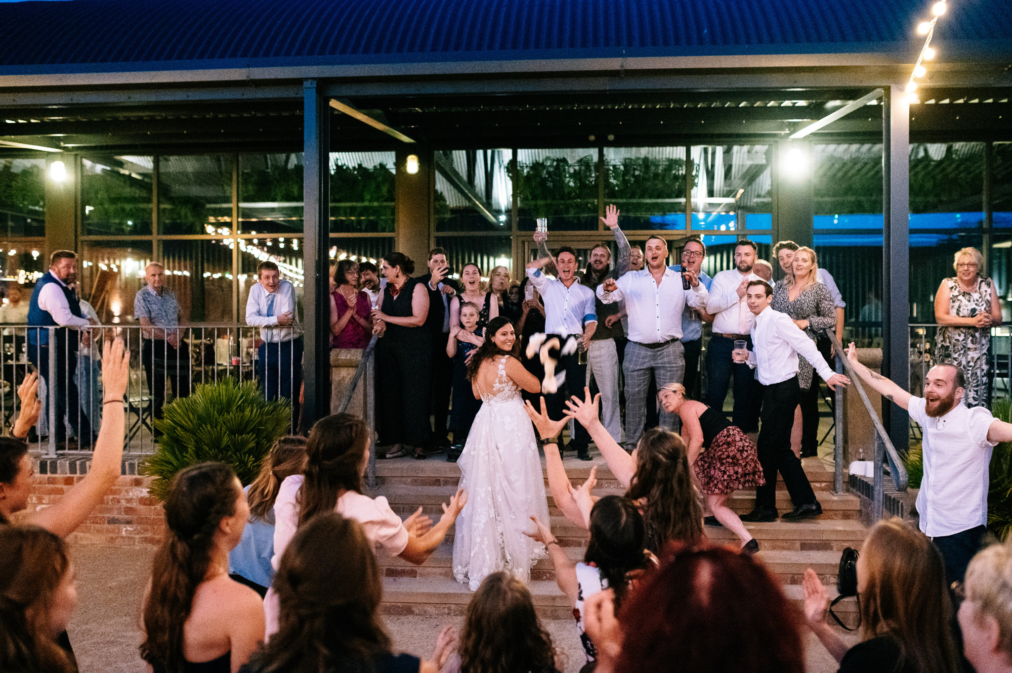 throwing the bouquet from the steps at grangefields