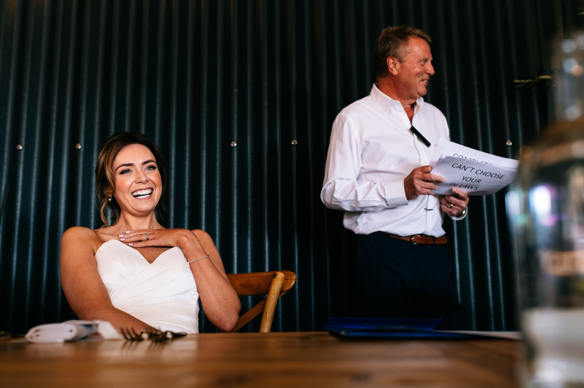 happy emotional bride during her father's speech