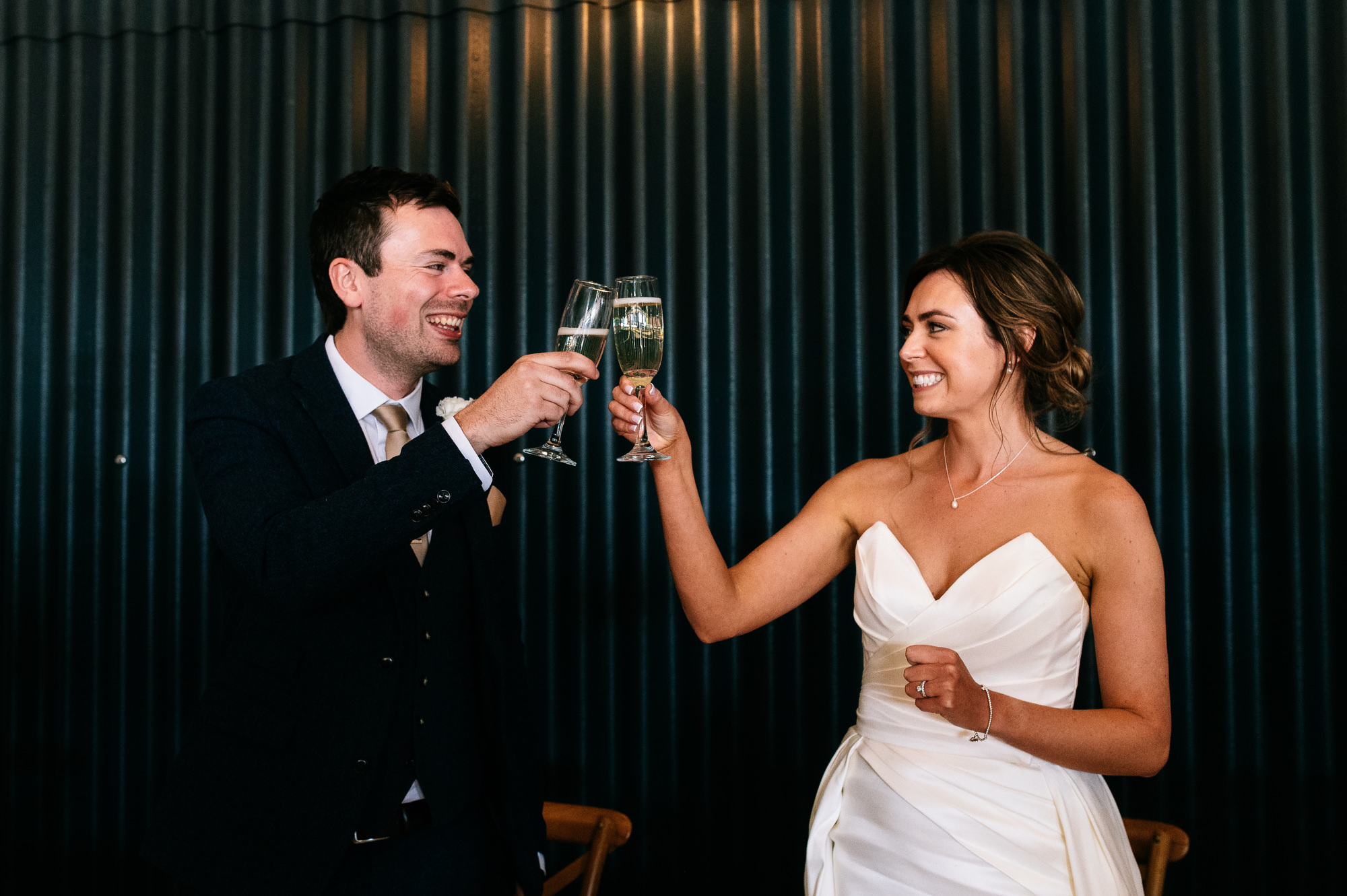 bride and groom toasting at grangefields