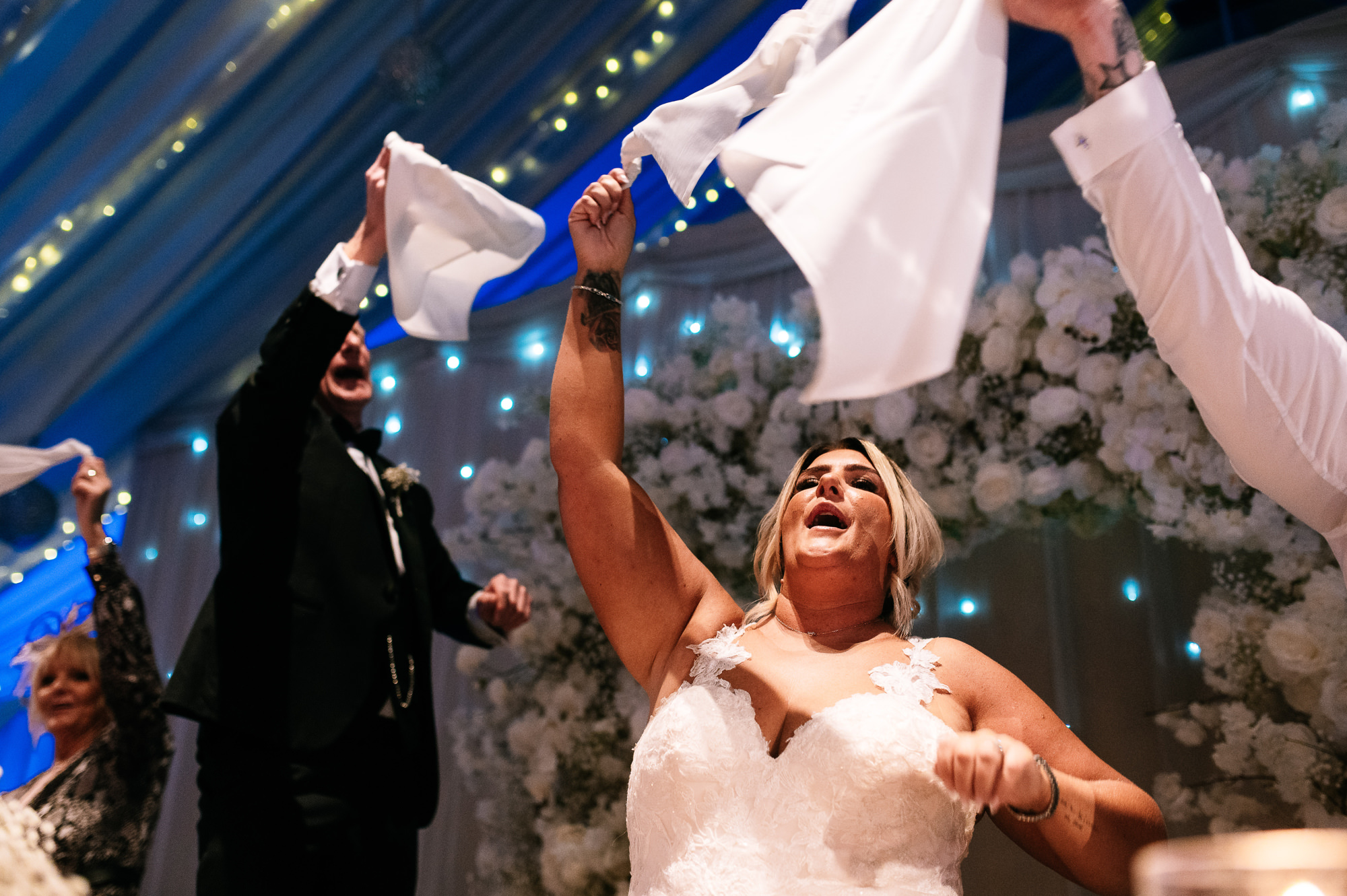 bride waving her napkin