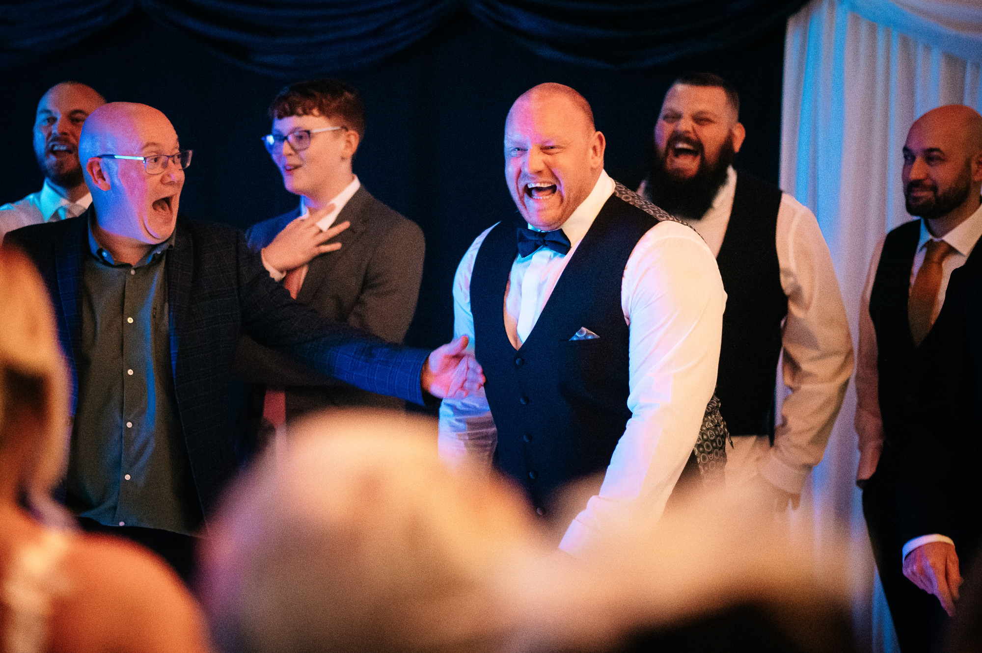groom and the guys for a sing off
