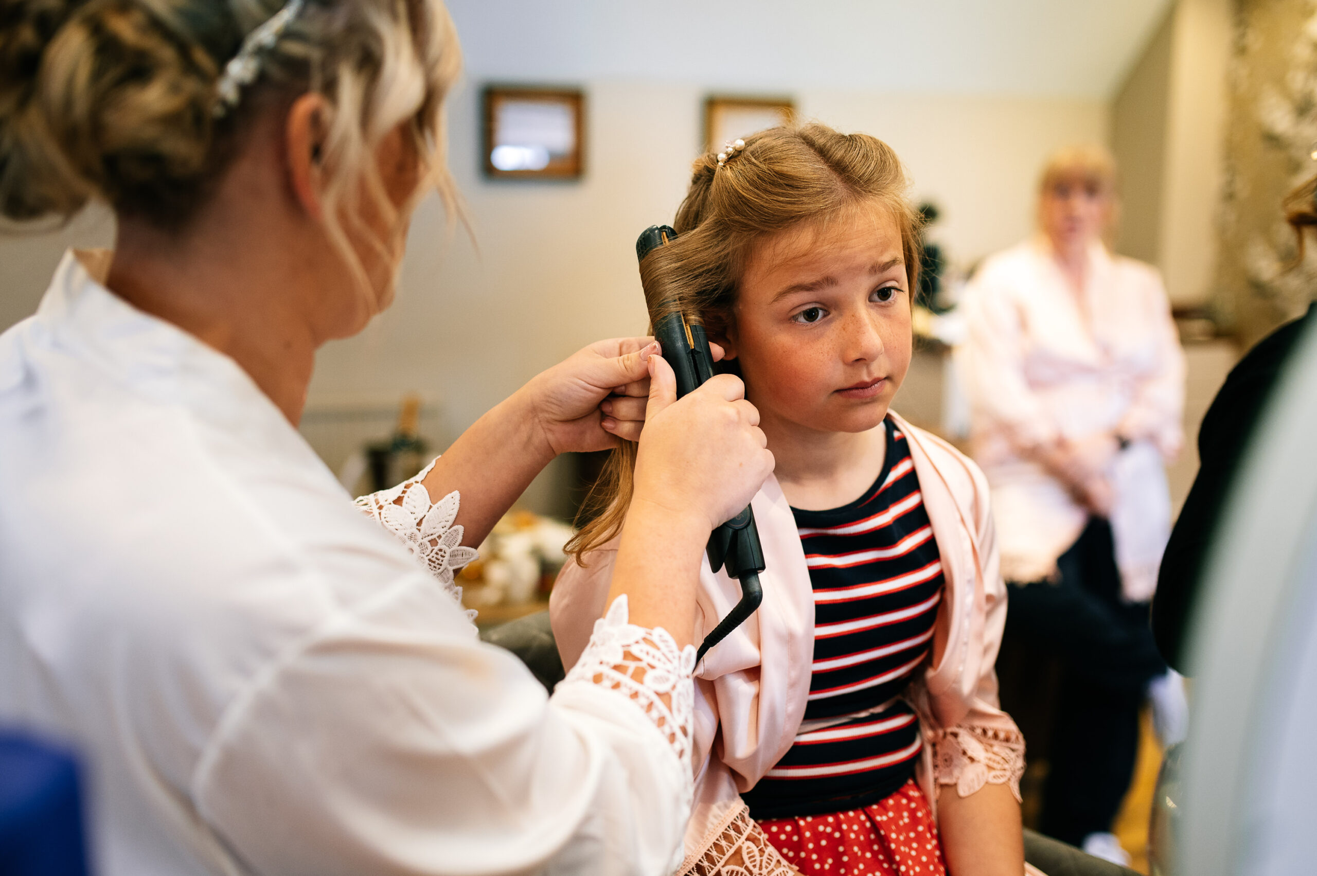 bride styling flower girls hair