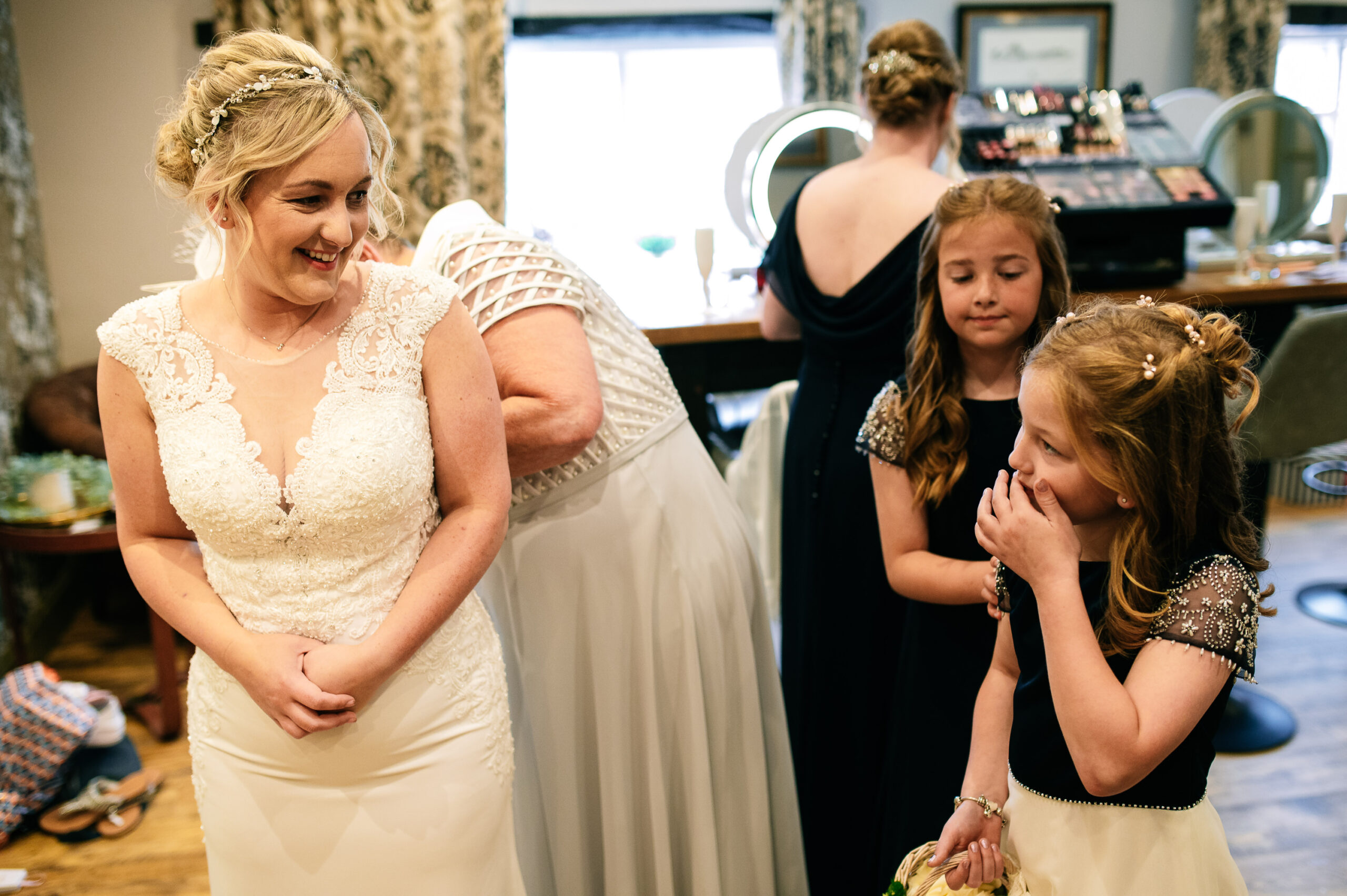 bride in her wedding dress with her daughter