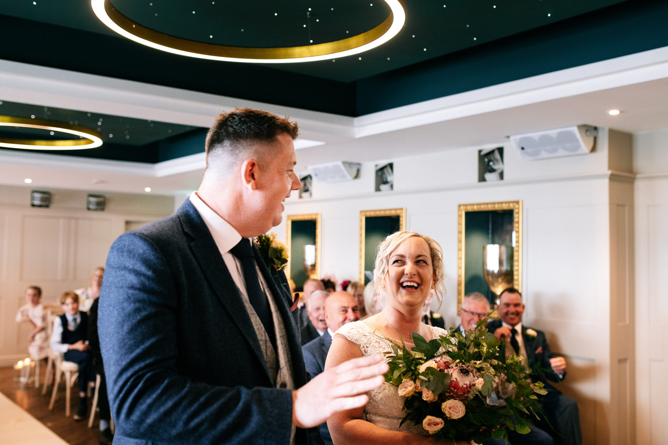 happy couple laughing during their wedding ceremony