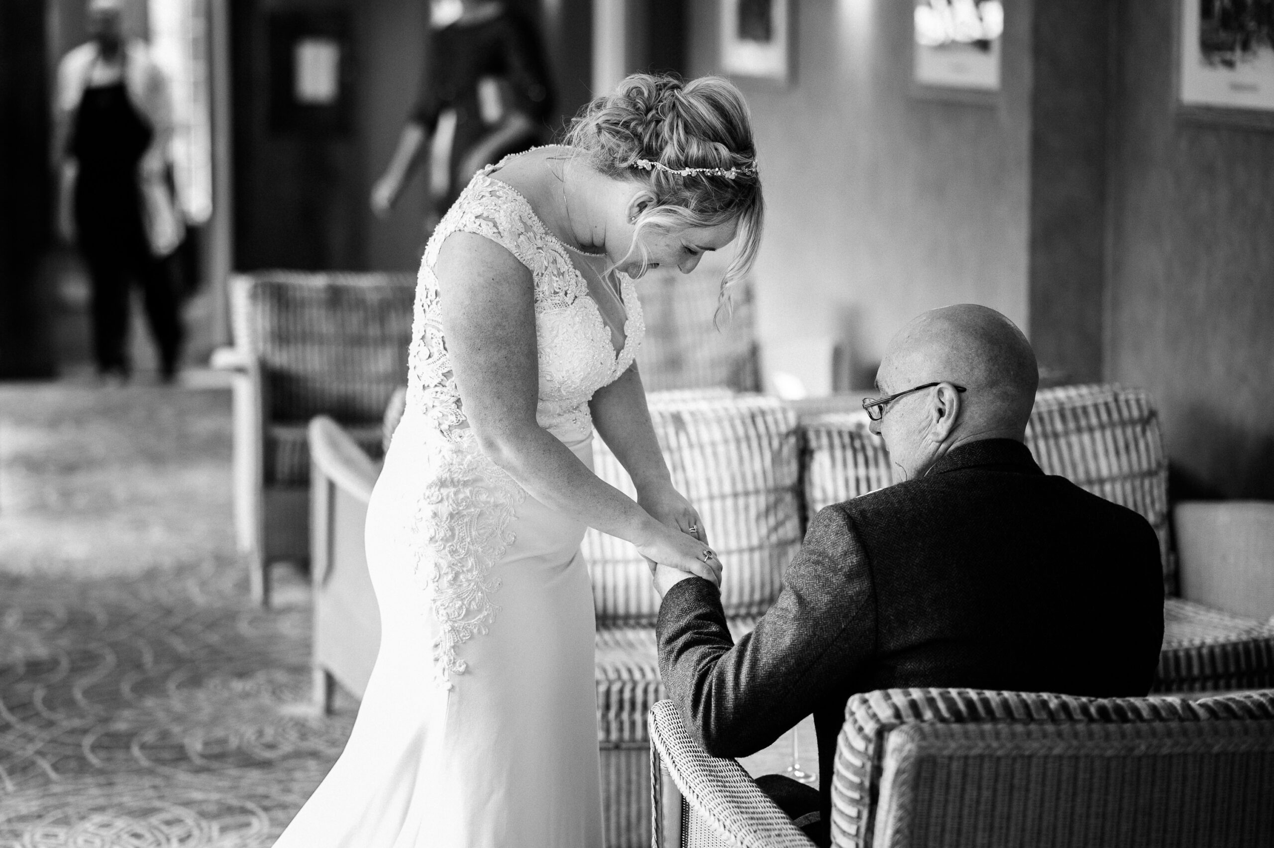 bride showing her wedding ring to her dad