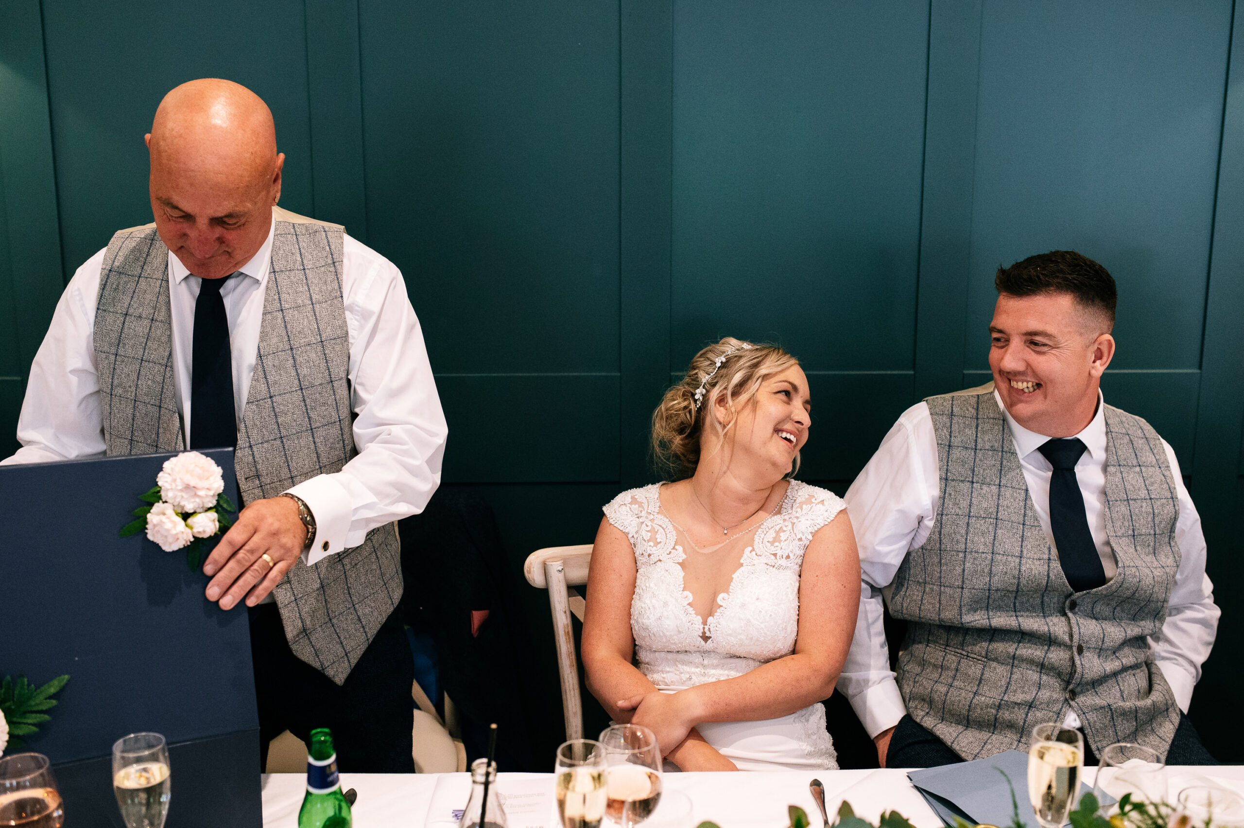 smiling couple during father of the brides speech