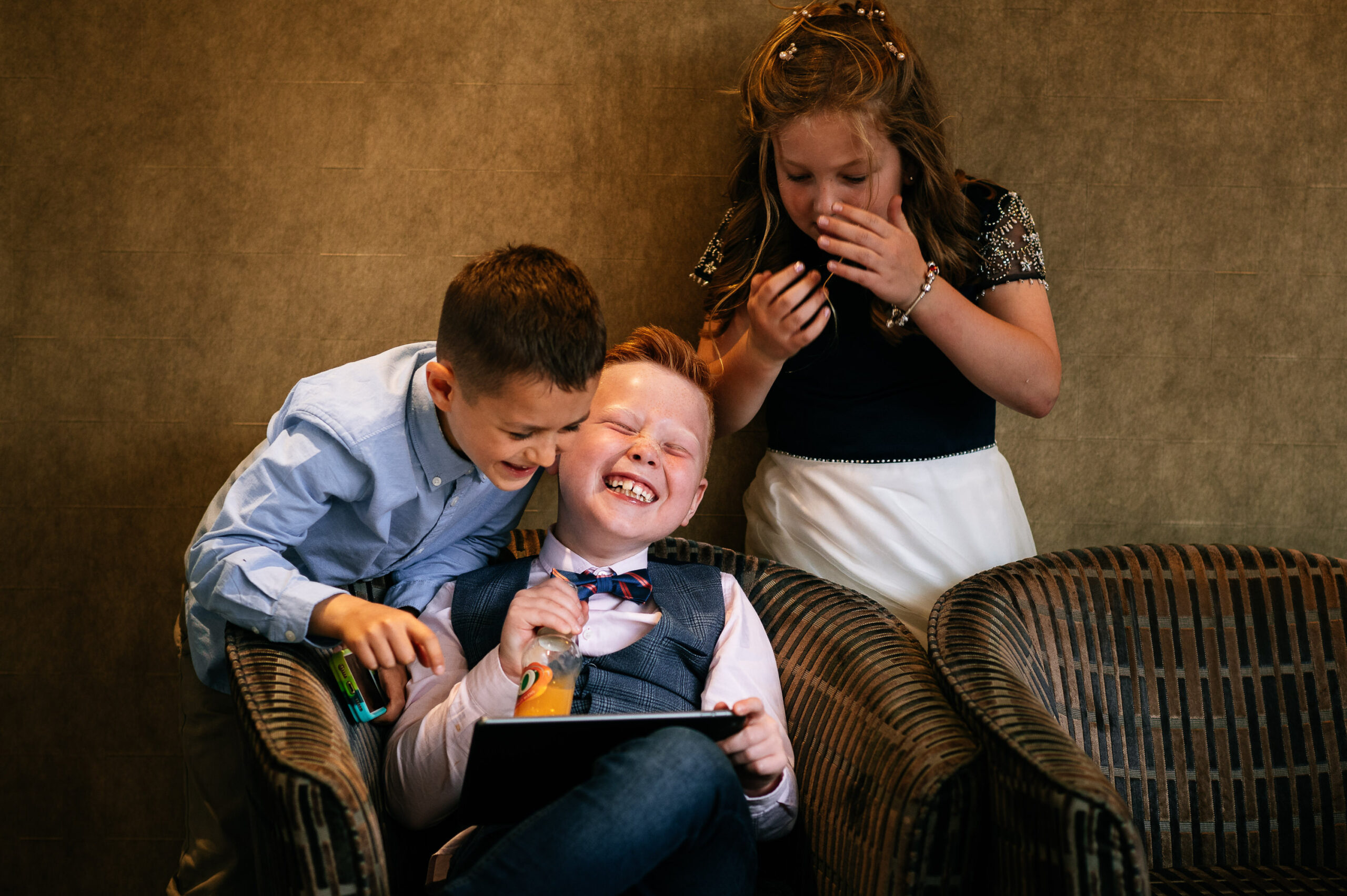 kids play together at wedding