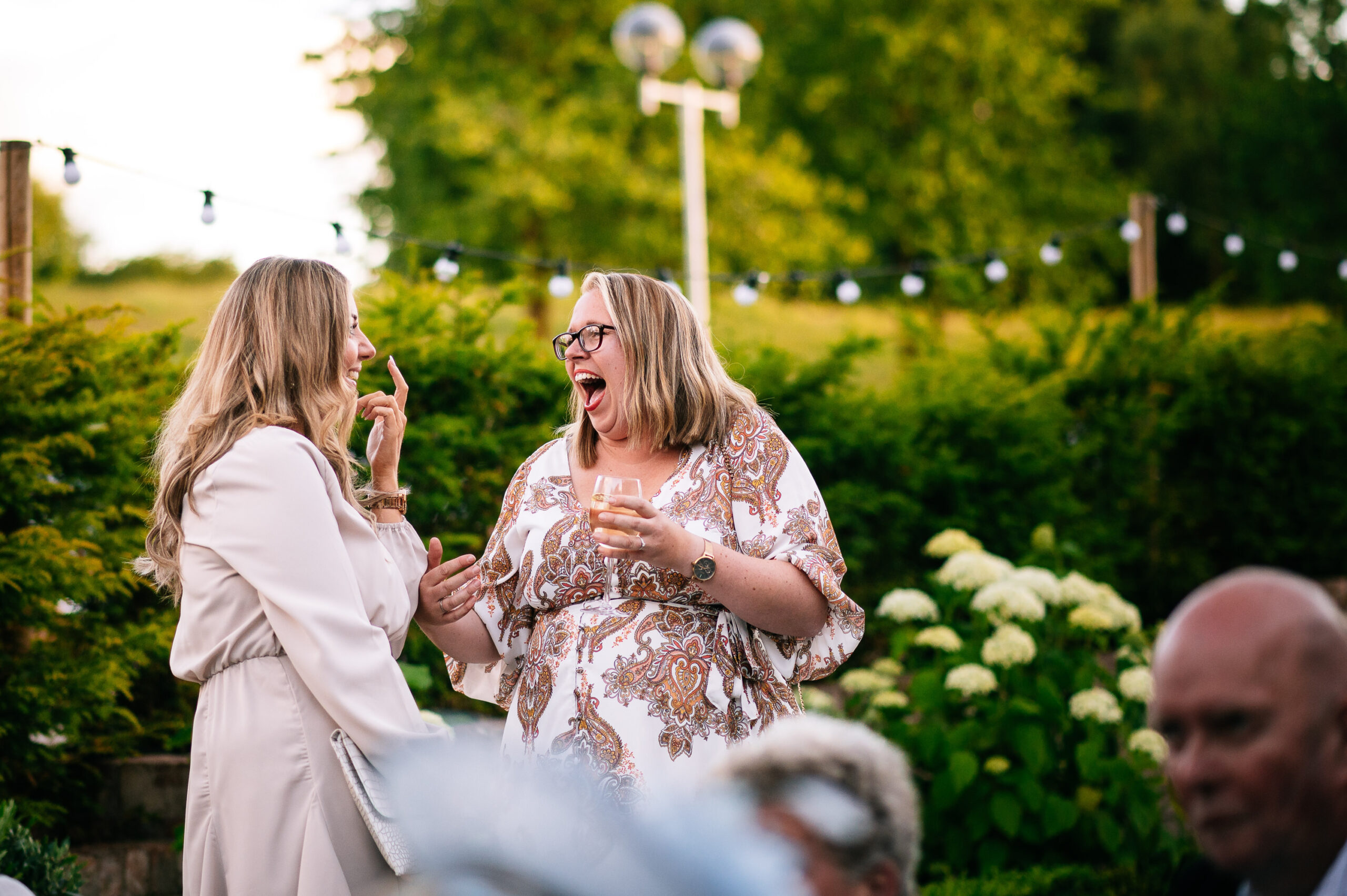 lady laughing outside as the sun sets
