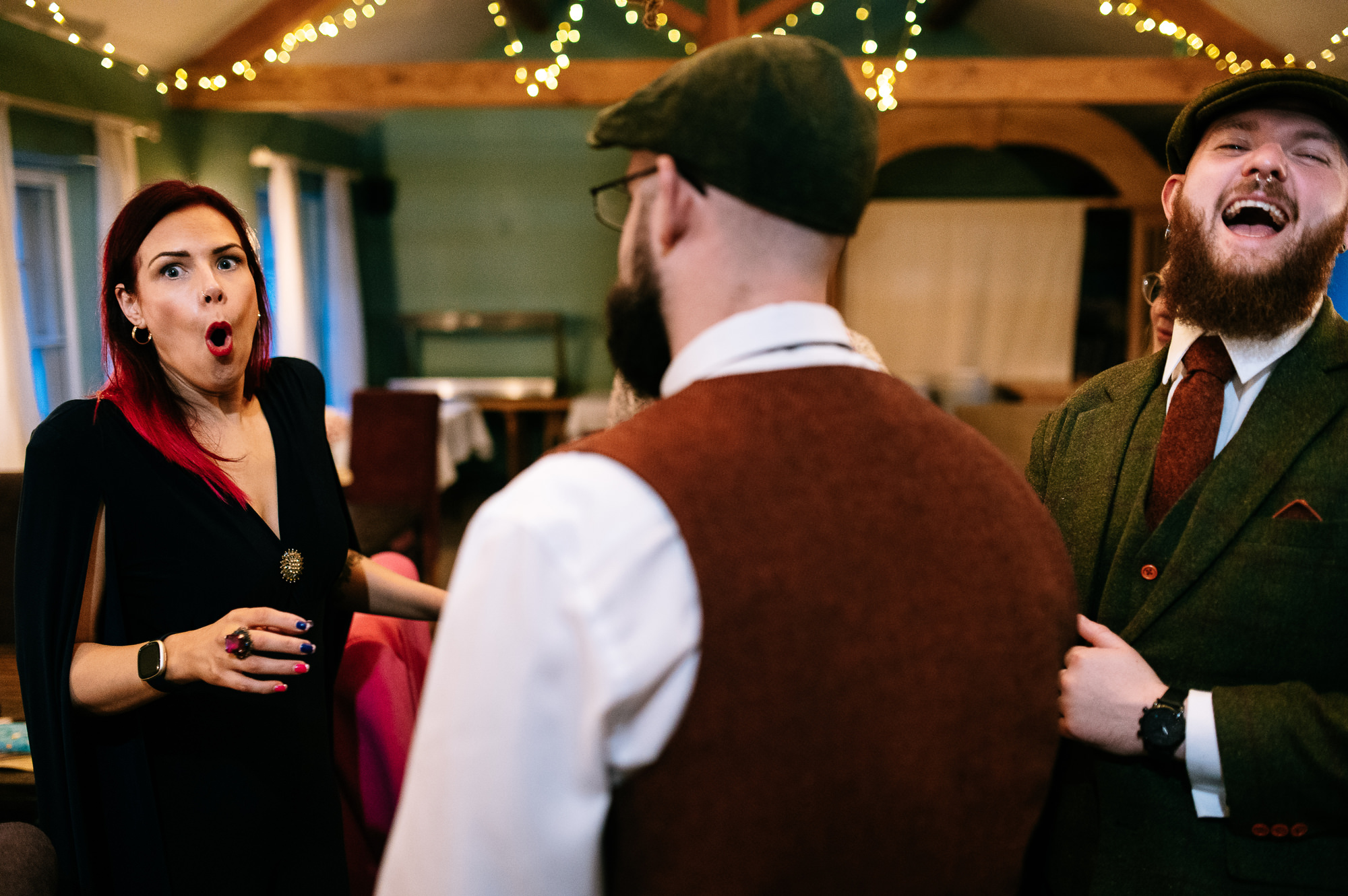 woman pulling a shocked face after the groom tells a joke