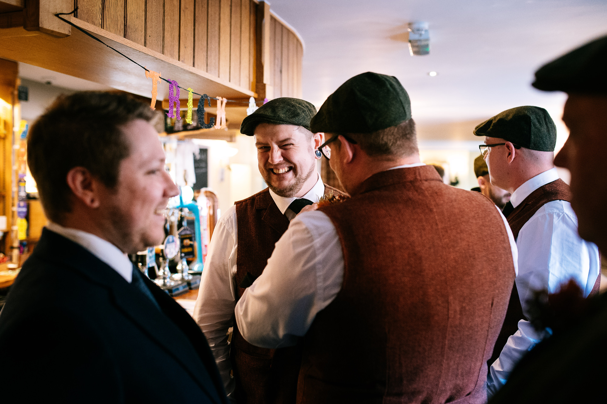 groomsmen at the bar before the wedding