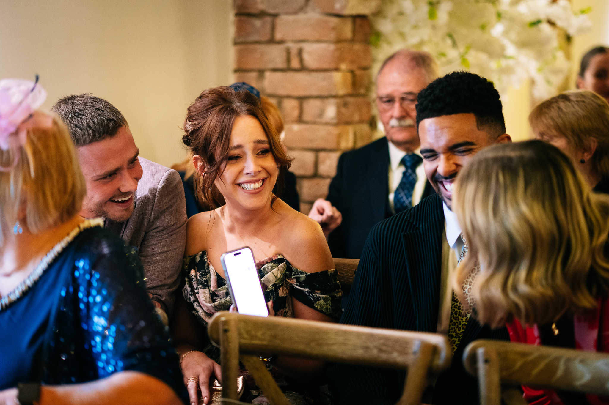 guests sharing a joke before the wedding ceremony