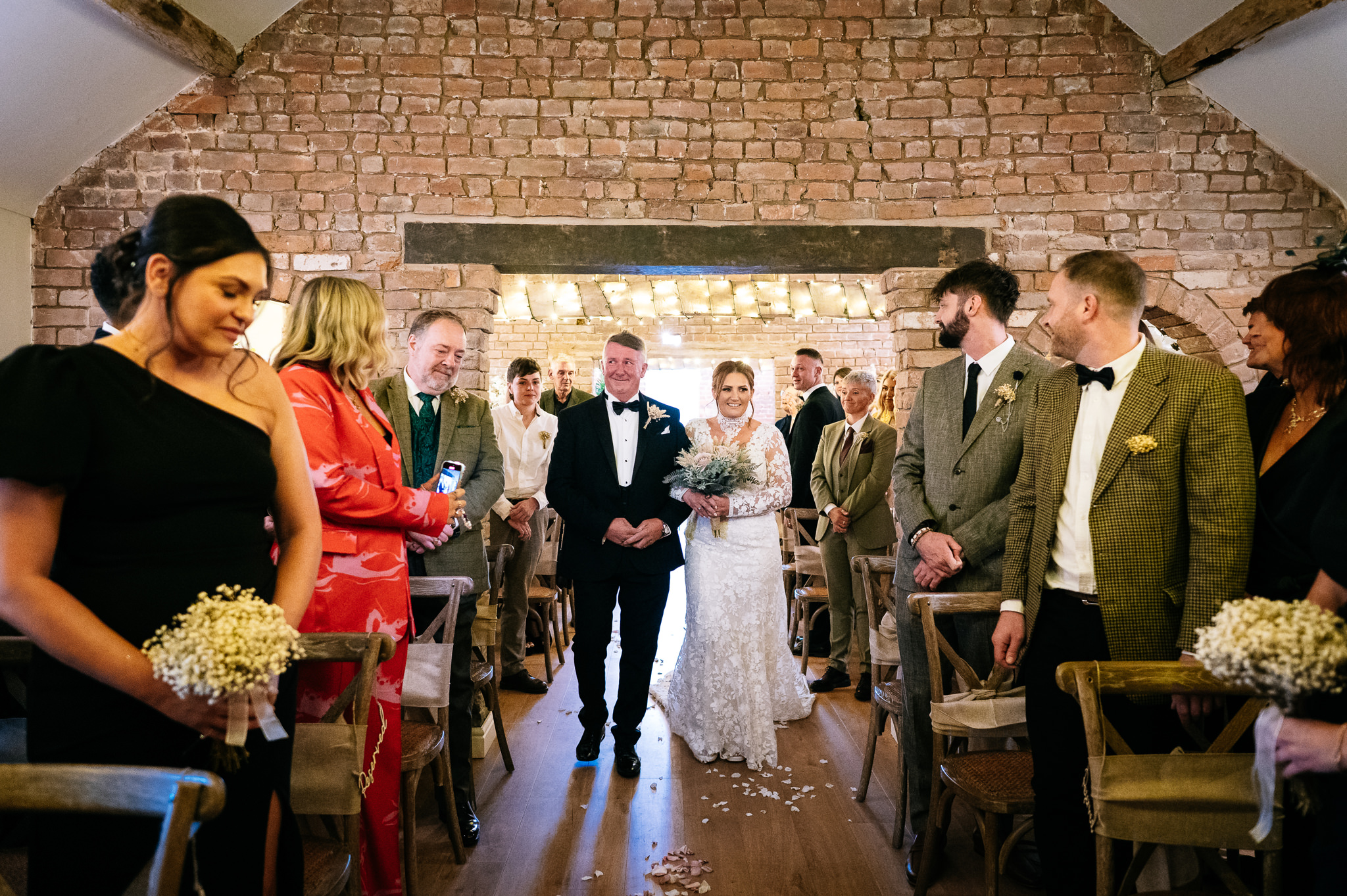 bride walking down the aisle with her father