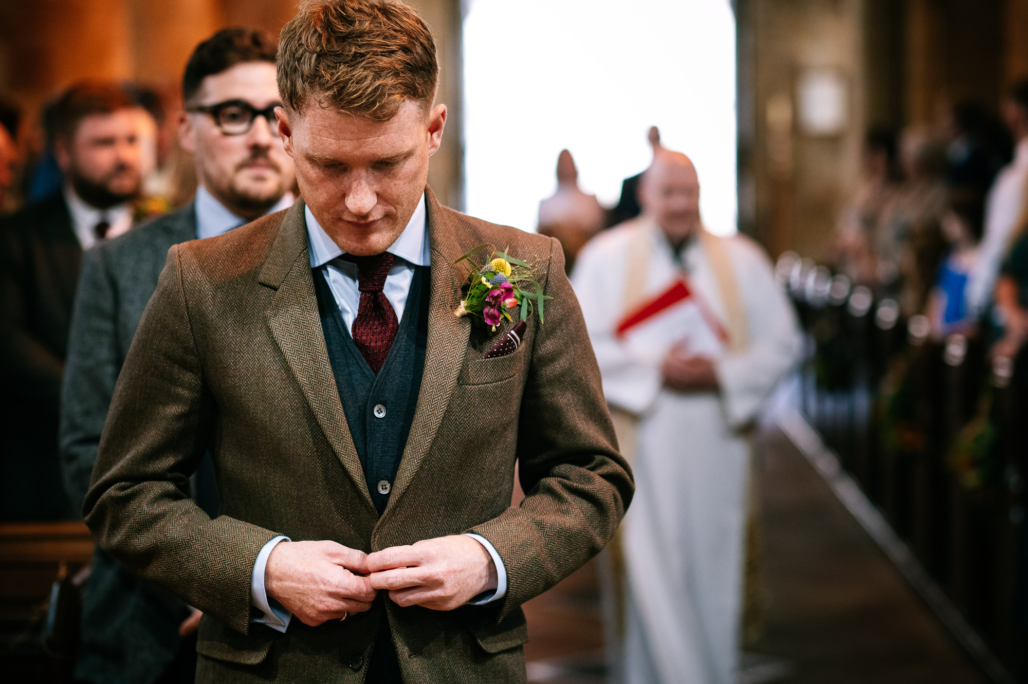 nervous groom waiting at the altar