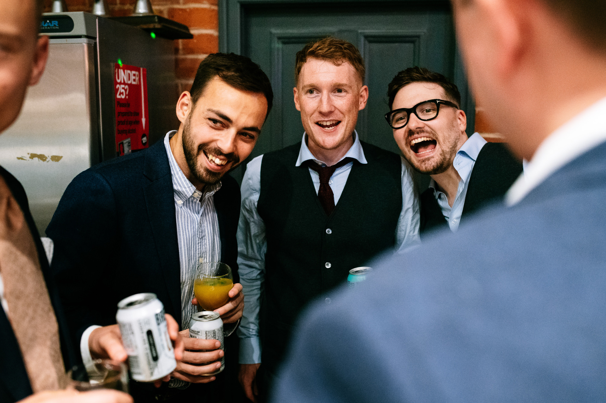 groom laughing with friends