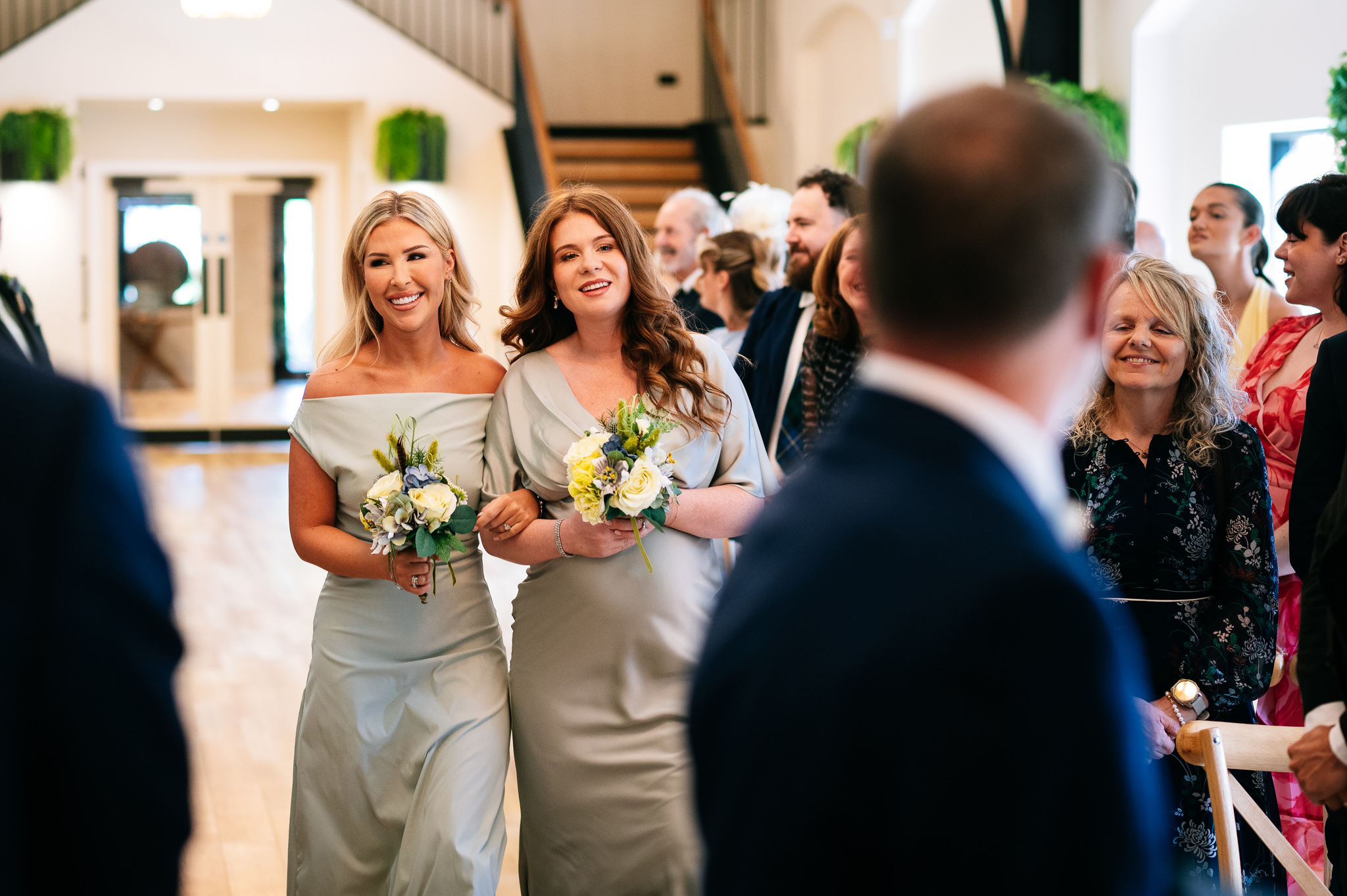 bride's daughters as bridesmaids walking down the aisle