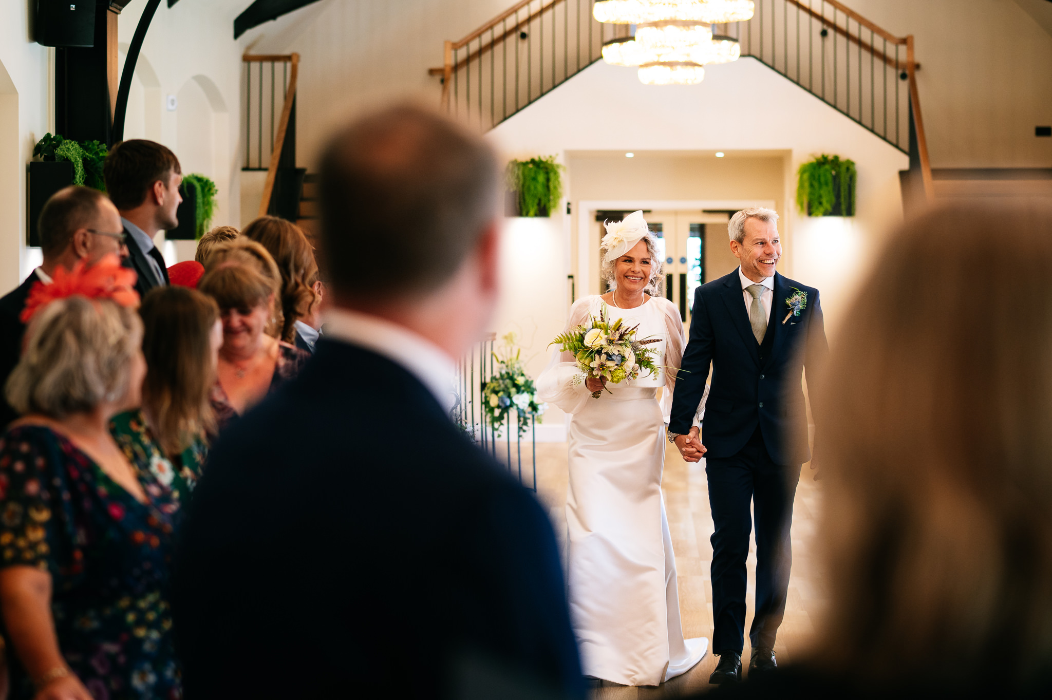 bride walking down the aisle with her brother