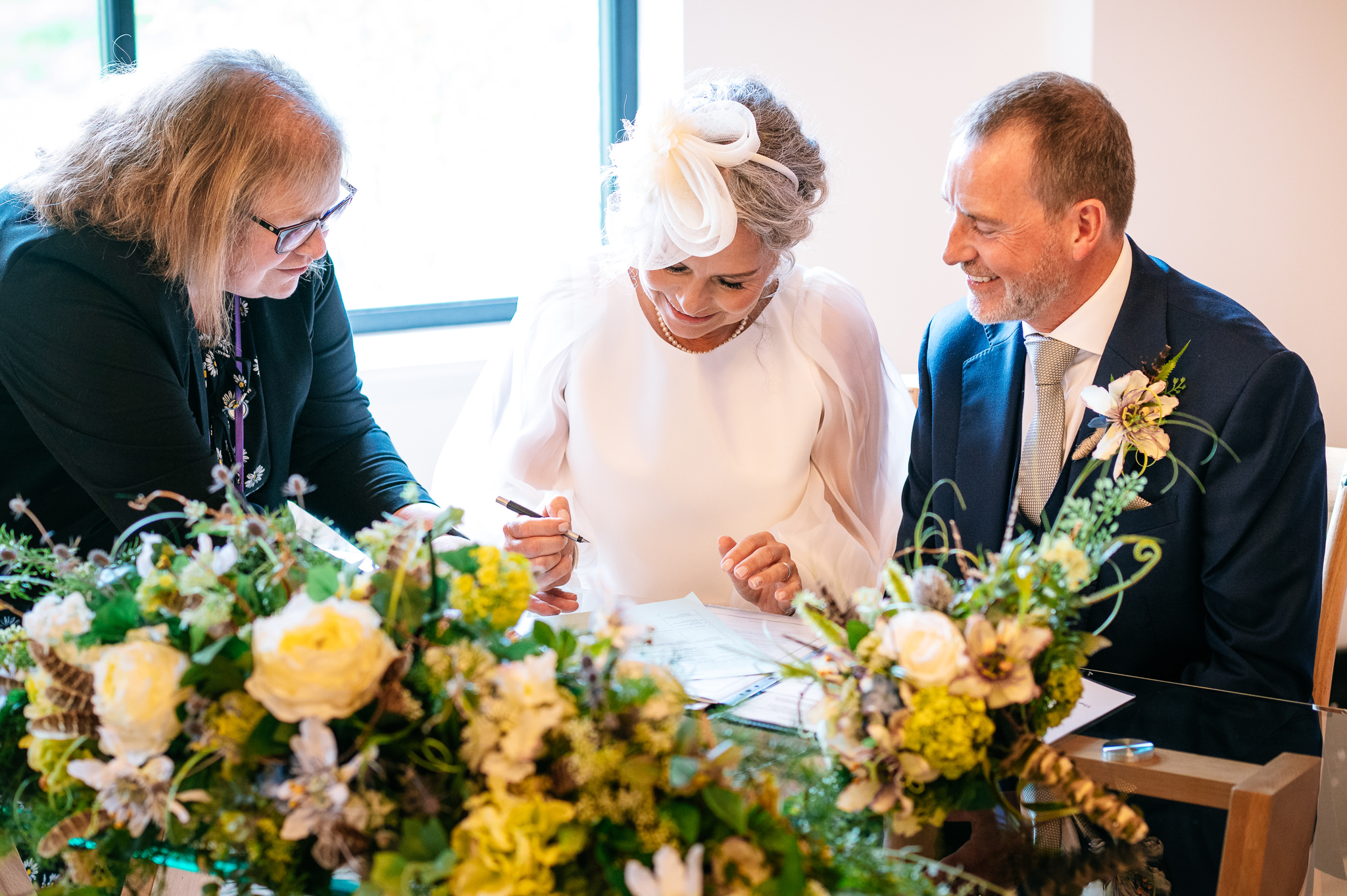 happy couple signing the register