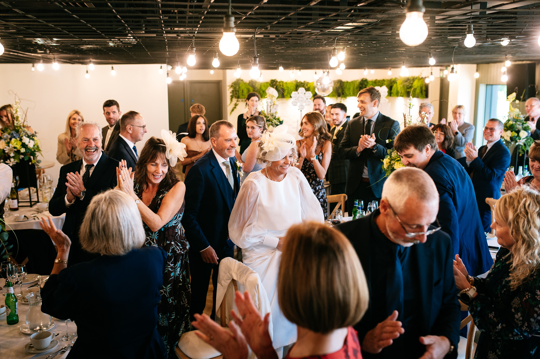 bride and groom entering their wedding breakfast together