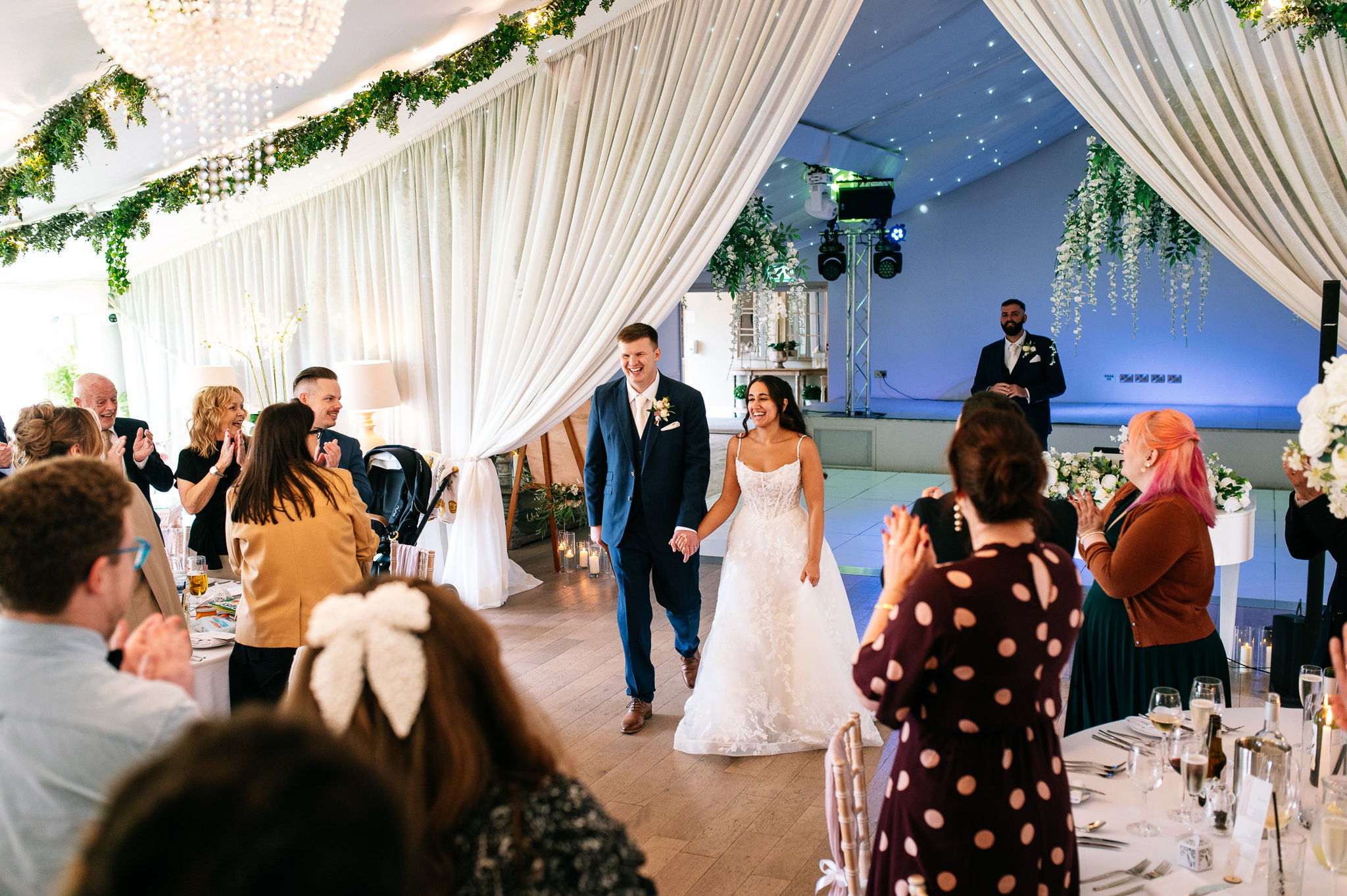 bride and groom entrance into the reception room at alrewas hayes in staffordshire