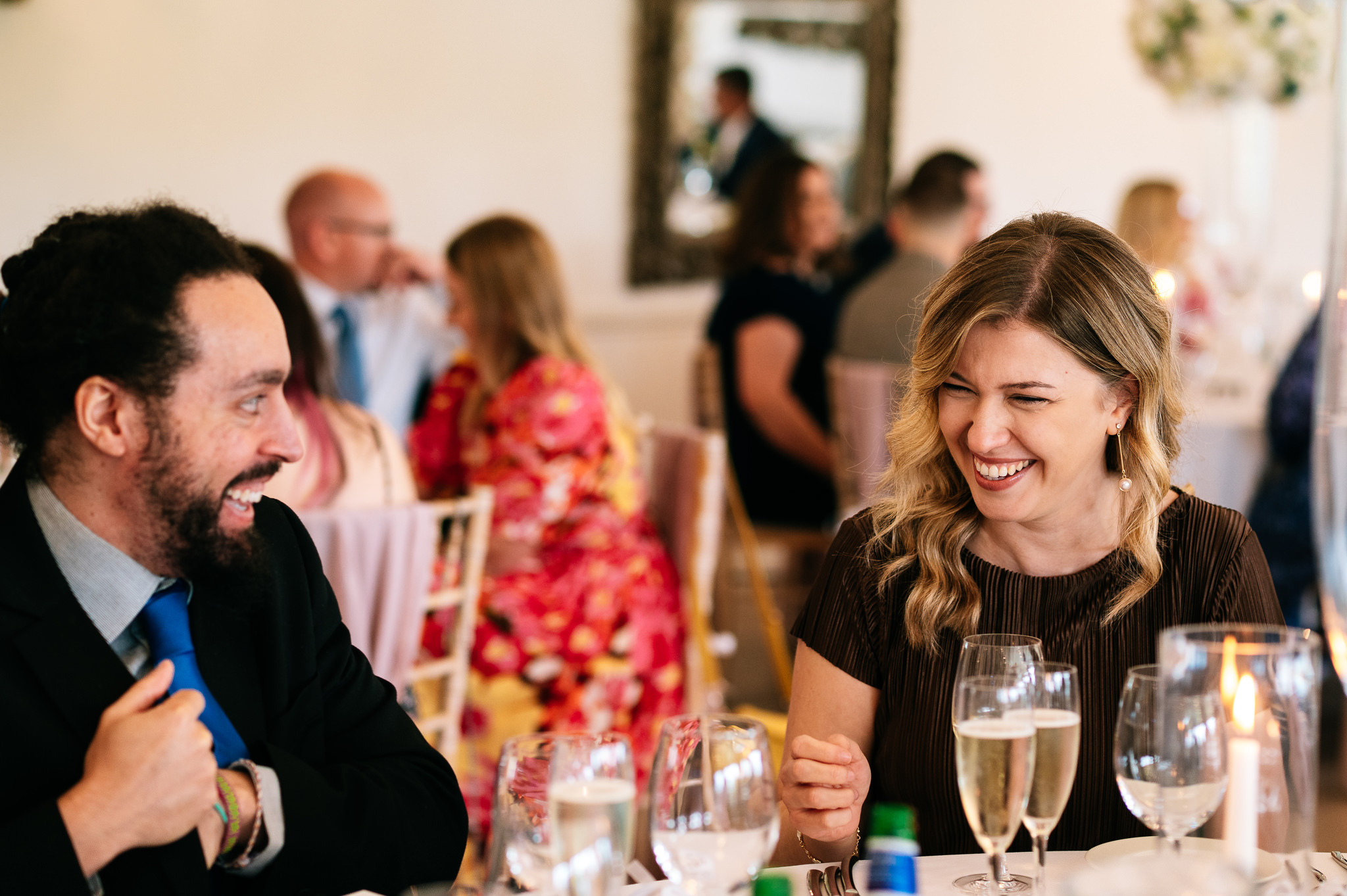 guests laughing during the speeches