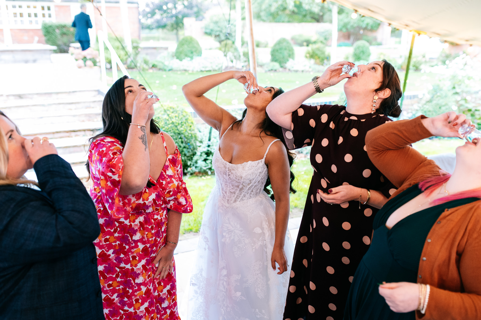 bride doing shots with her friends