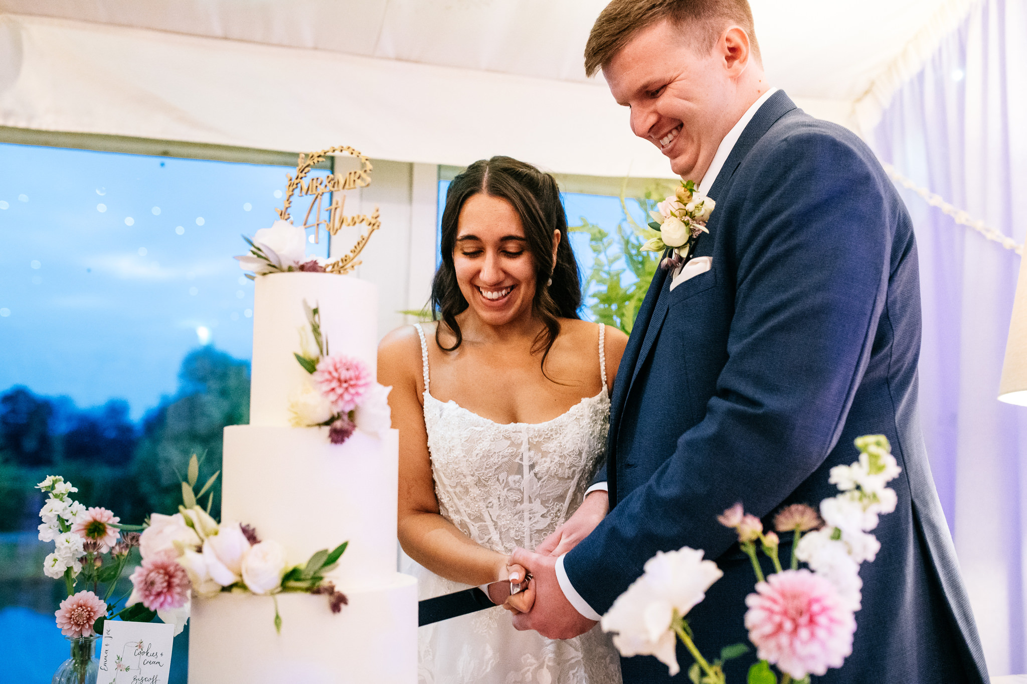 newlyweds cutting their wedding cake