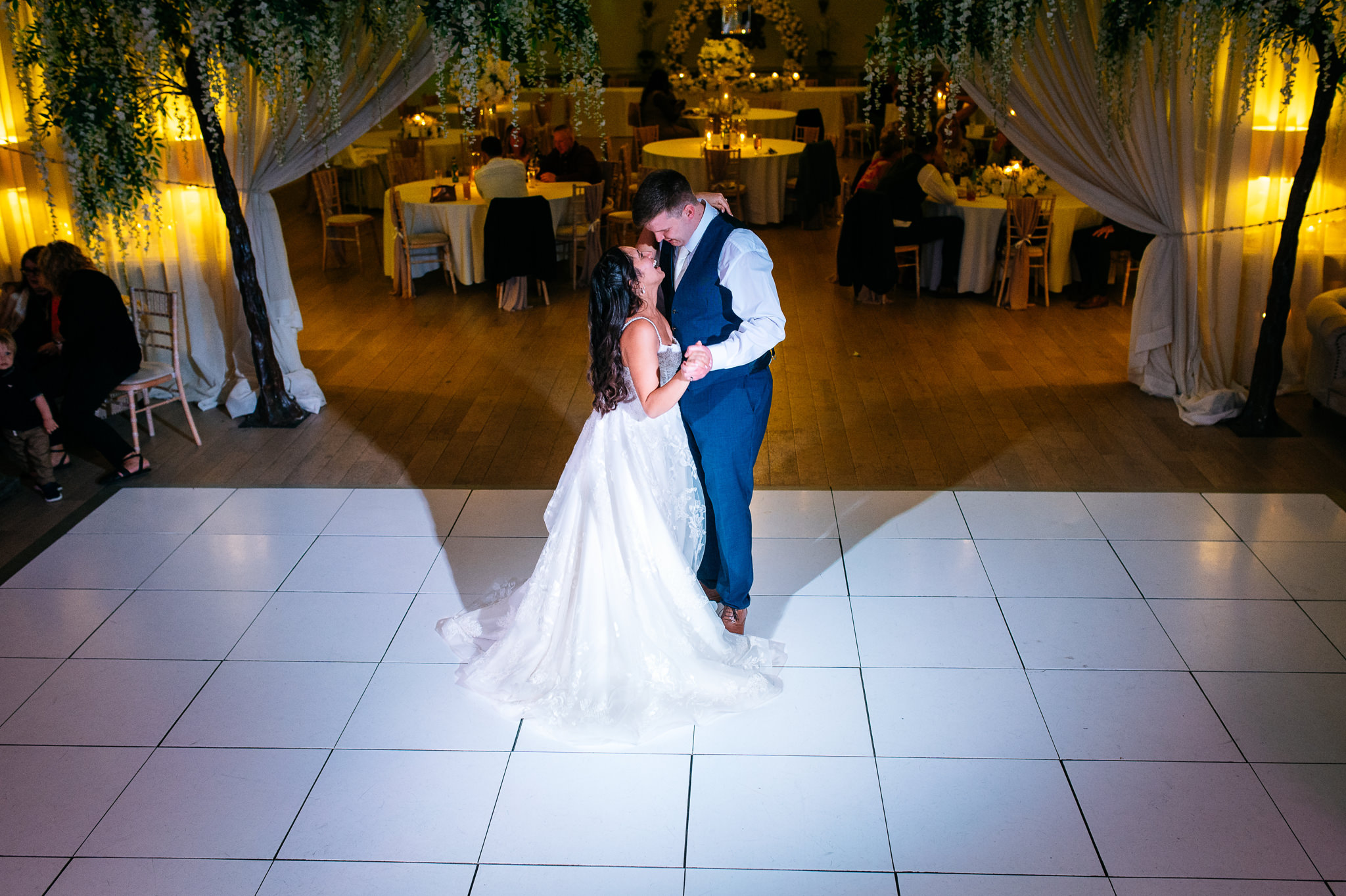 happy couple share a moment together on an empty dance floor
