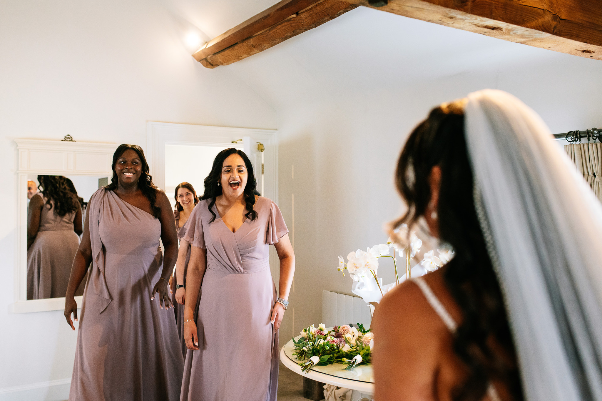 bridesmaids have a first look with the bride