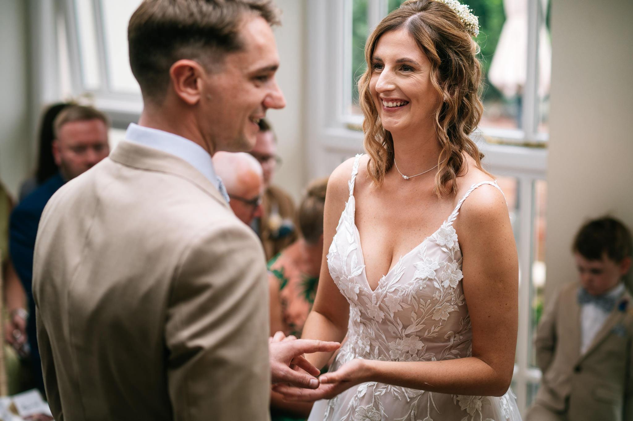 happy smiling bride looking at her husband during the wedding ceremony