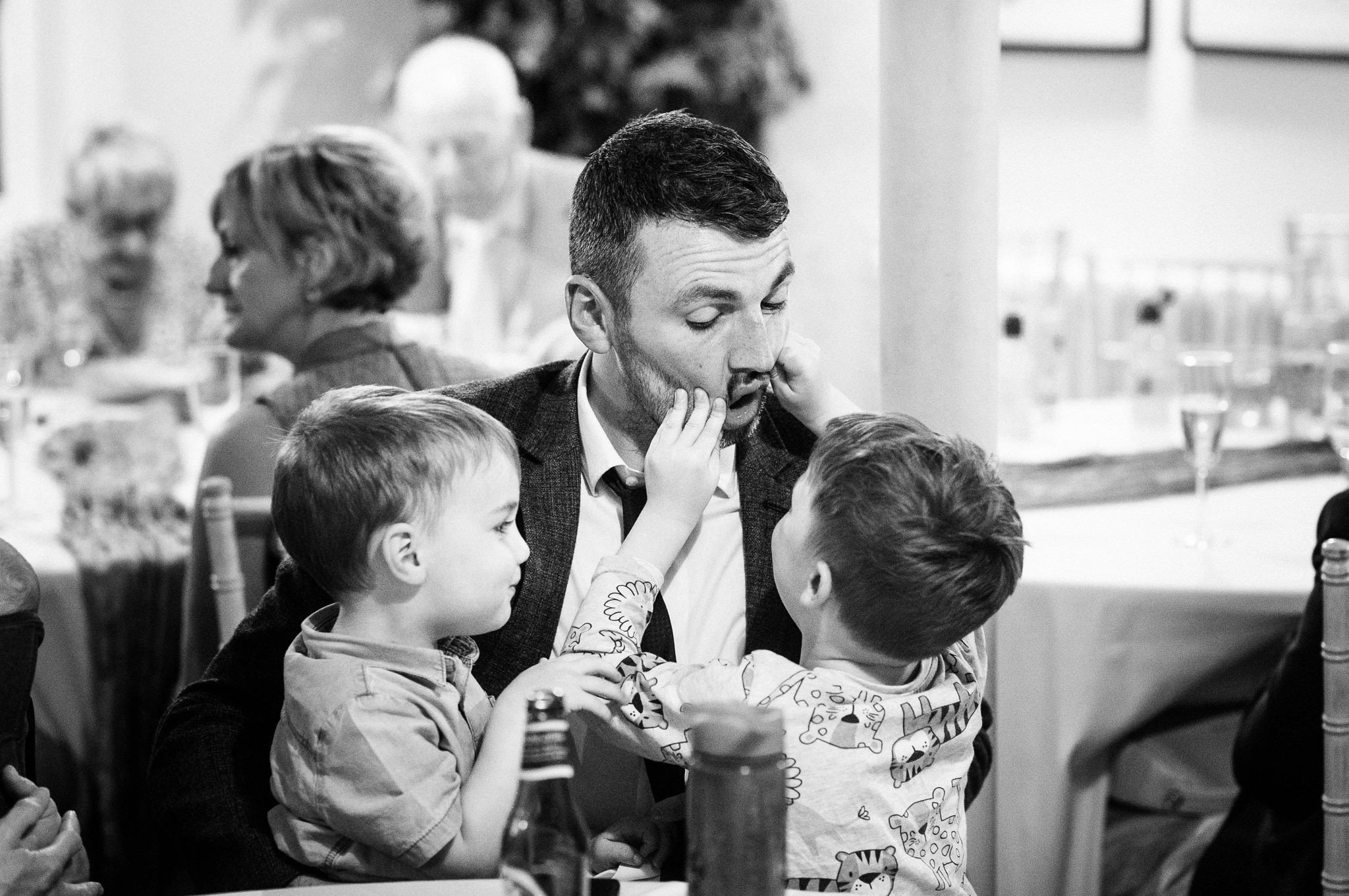 wedding guest playing games with two boys