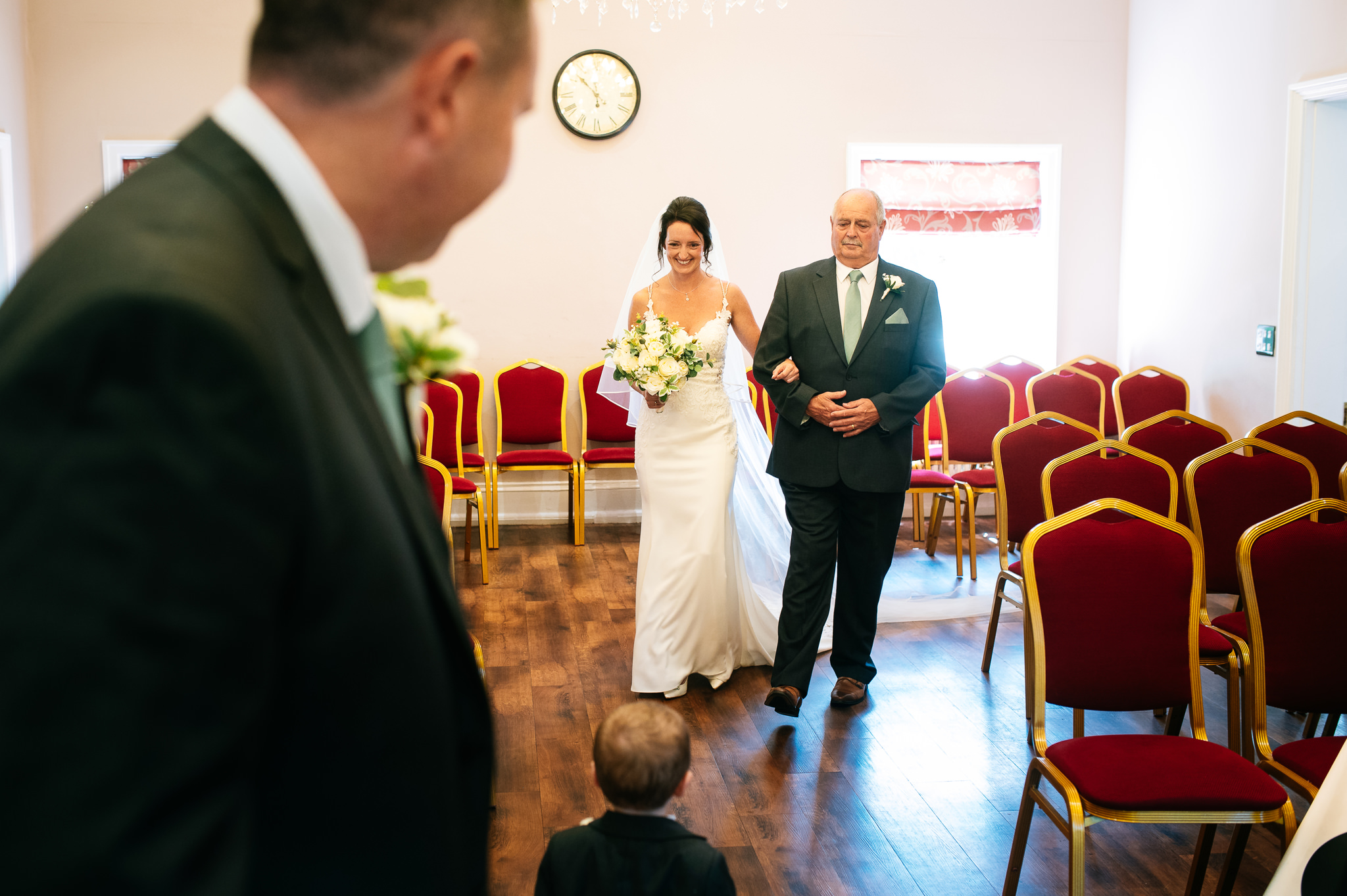 bride walking down the aisle with her father at bridgford hall in west bridgford