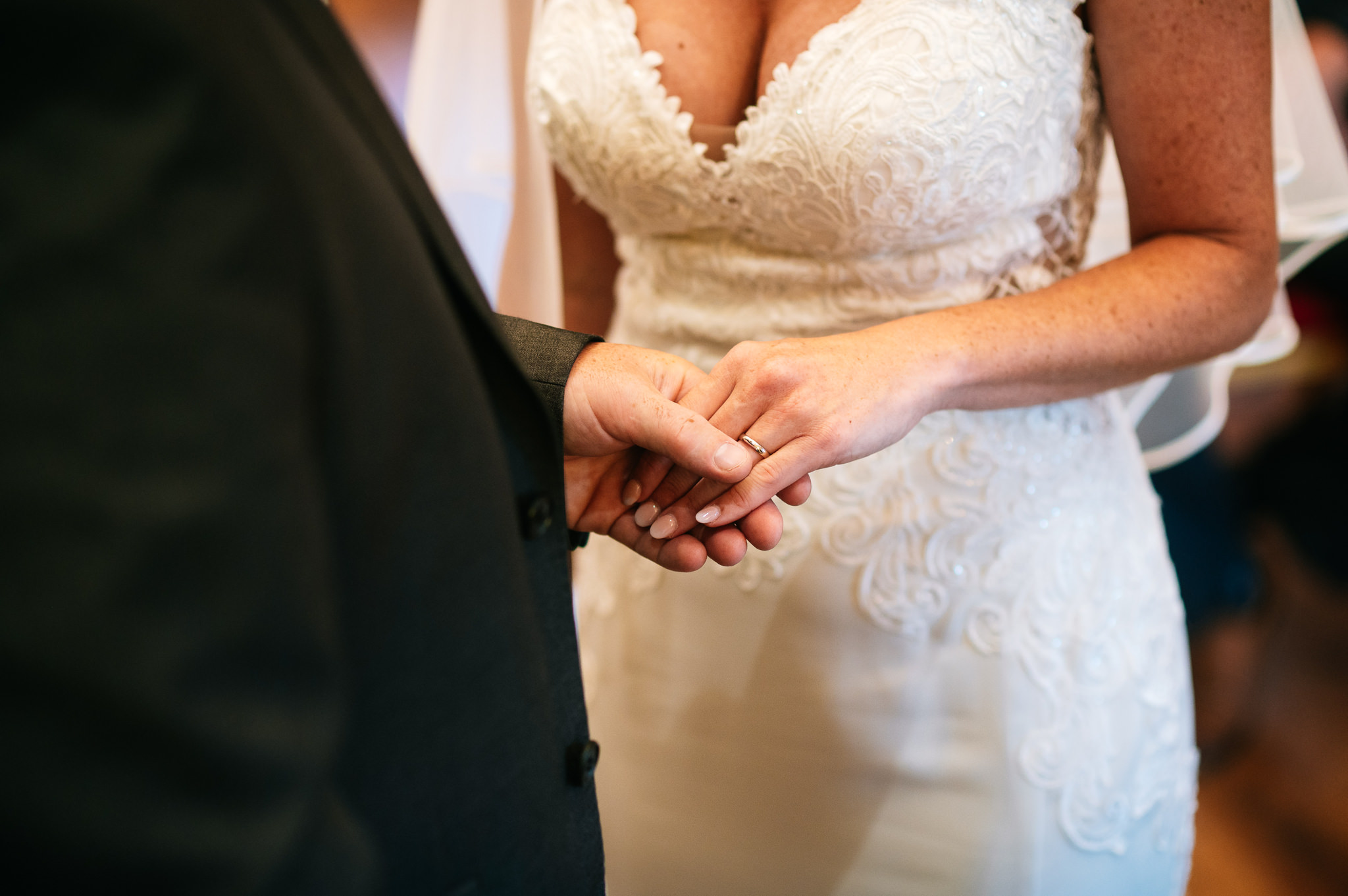 a close up of the exchange of rings