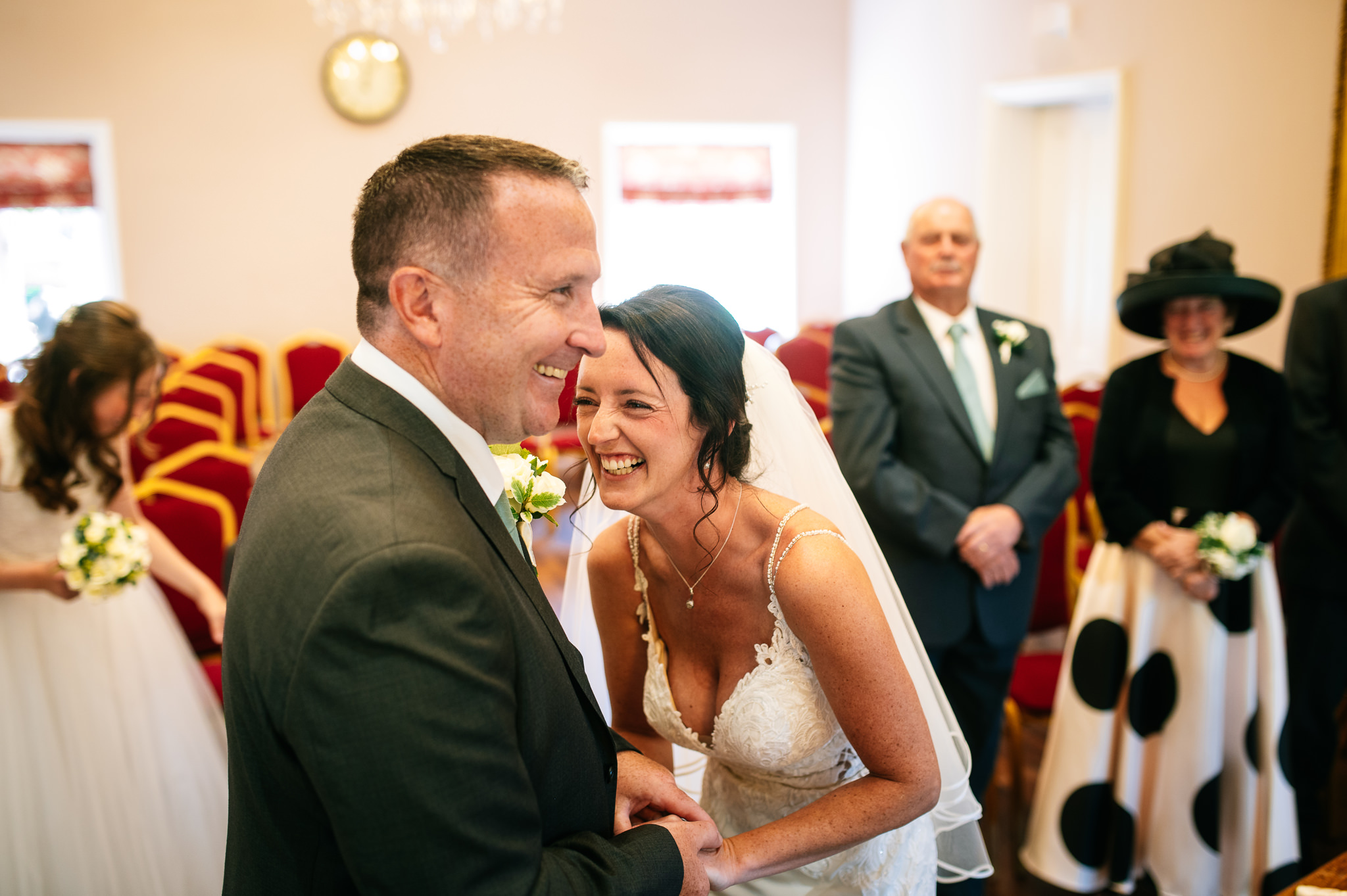 bride and groom laughing during their wedding ceremony